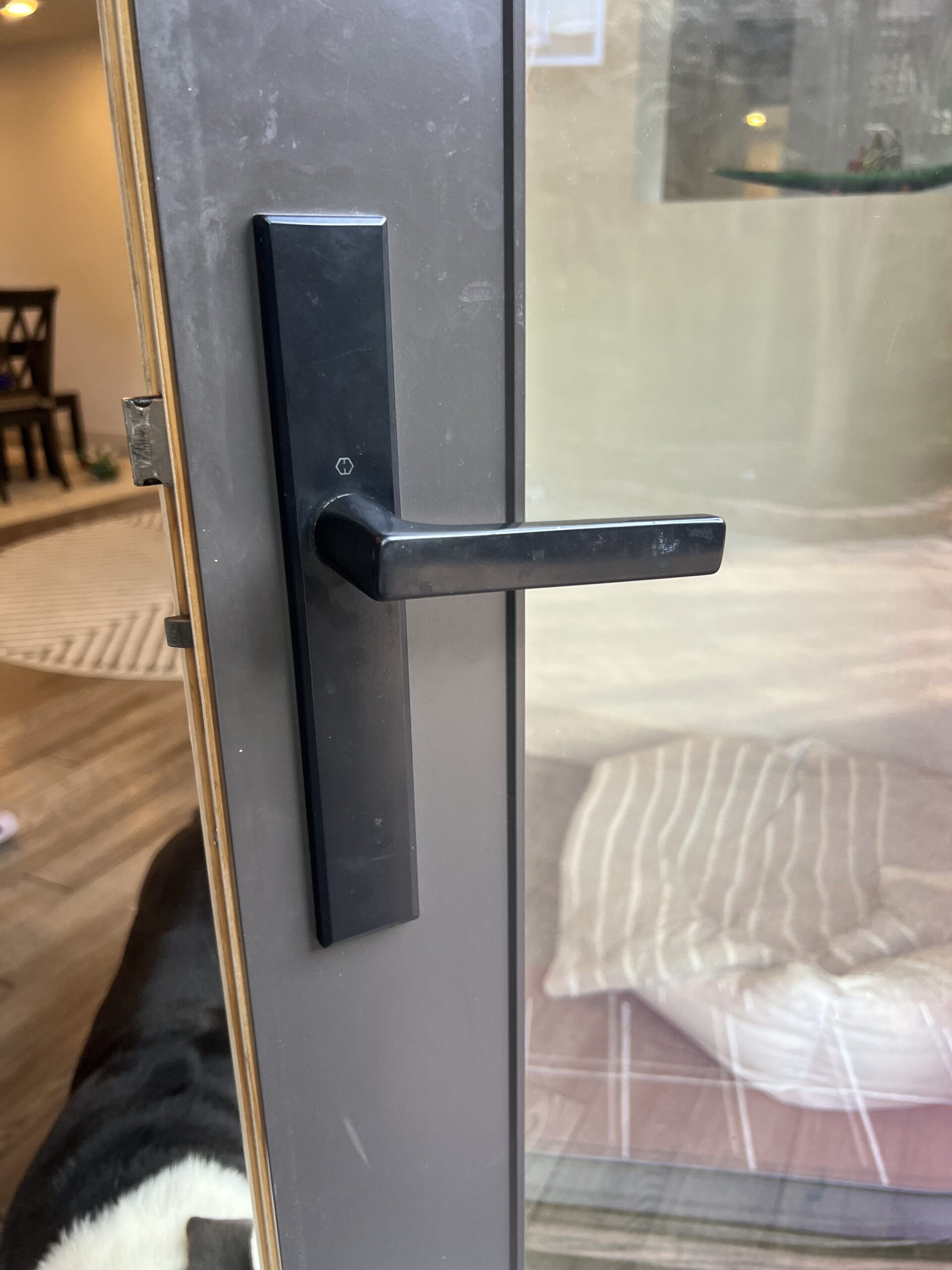 Full-length multipoint lock faceplate installed along the edge of an exterior door